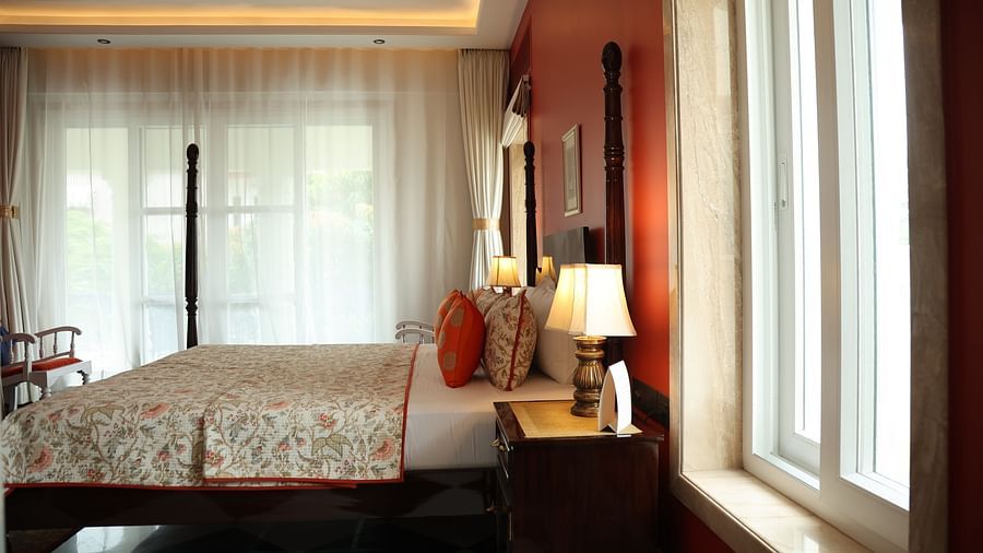 A room at Dileep Kothi, Jaipur with a double bed and side tables with night lamps